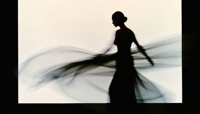 Silhouette dancer twirling chiffon gown backlit by bright panel, elegant motion and flow