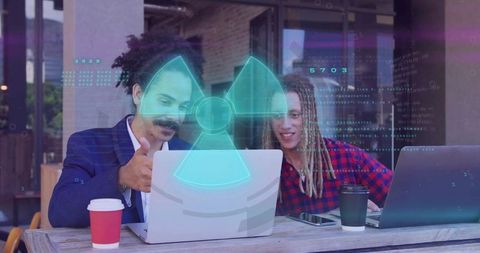 Professionals collaborating with laptops and holographic interface on urban cafe terrace