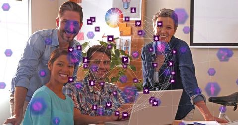 Diverse team collaborating with digital interface in creative office