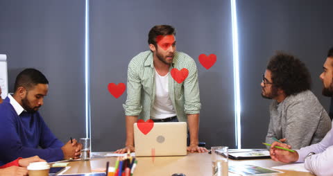 Animated Heart Shapes Around Discussion in Modern Office