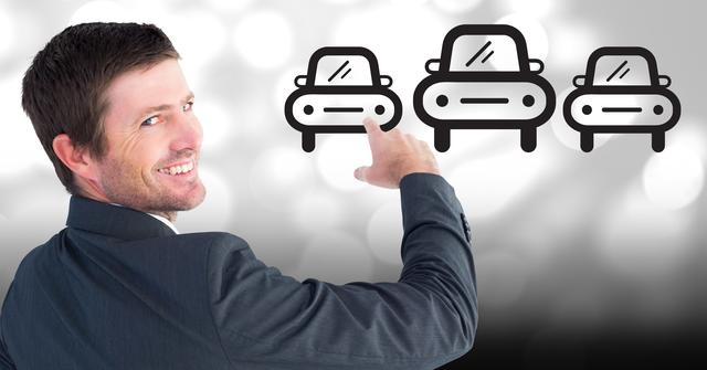 The image features a smiling businessman dressed in a suit, pointing at car icons on a bokeh background. This modern, conceptual design can be used for ads related to car sales, technology in transportation, business presentations, vehicle selection services, and marketing material.