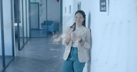 Professional woman multi-tasking with technology in modern workplace