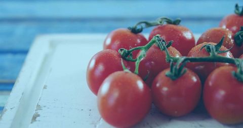 Fresh Cherry Tomatoes on Rustic White Board in Kitchen