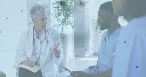 Healthcare Team Engaged in Discussion in Modern Hospital Corridor