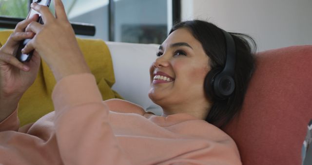 Woman Relaxing with Headphones and Smartphone at Home - Download Free Stock Images Pikwizard.com