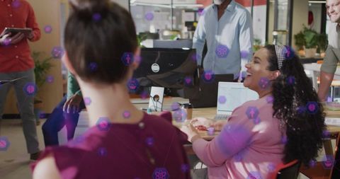 Diverse Team Collaborating in Modern Office Environment with Digital Overlay