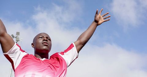 Victorious Athlete Celebrating Tournament Victory Under Clear Sky