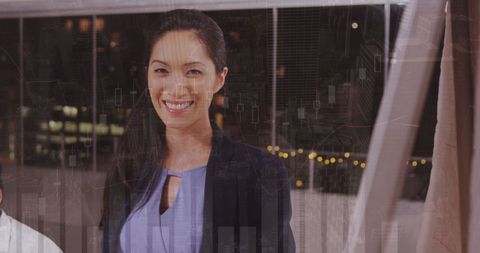 Businesswoman Viewing Digital Financial Data at Night