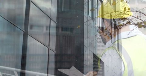 Construction worker inspecting building structure