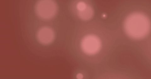 Glowing light spots on brown background