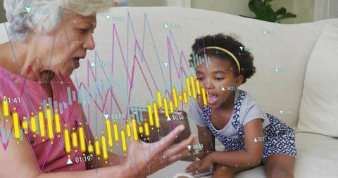 Grandparent and child exploring tablet with interactive financial charts and learning