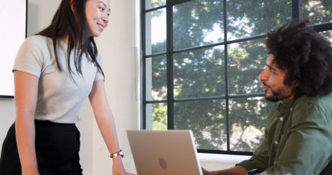 Two Professionals Collaborating in Modern Office Space