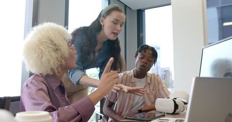 Diverse Team Collaborating on Innovative Tech Project with VR