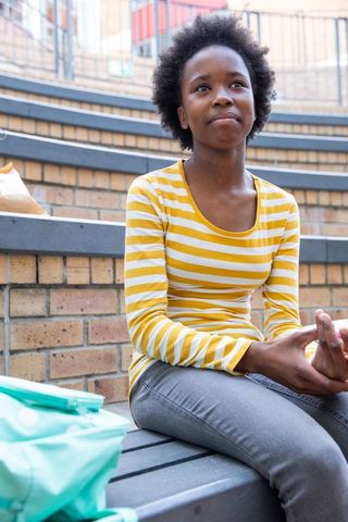 Teen student relaxing outdoors campus atmosphere learning inspiration