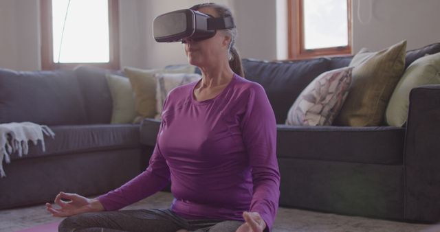Senior Woman Meditating with Virtual Reality Headset in Living Room - Download Free Stock Images Pikwizard.com