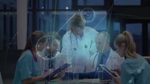 Medical Team Discussing Patient Data with Digital Interface