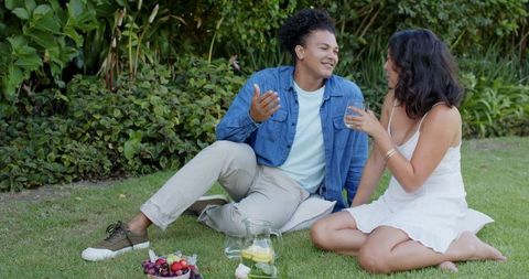 Joyful Couple Enjoying Picnic in Lush Garden