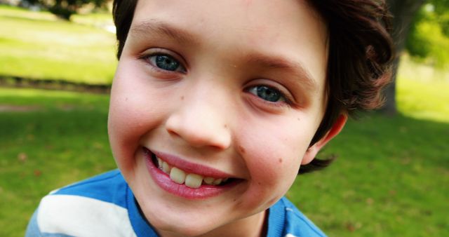 Happy Child Smiling Outdoors in a Park - Download Free Stock Images Pikwizard.com