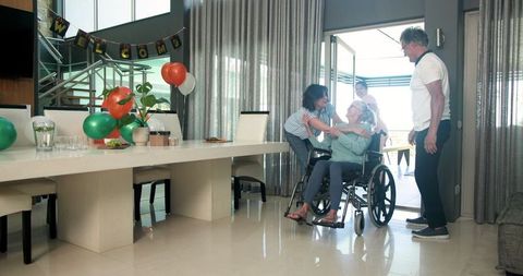 Multiethnic team welcoming female patient to physiotherapy clinic