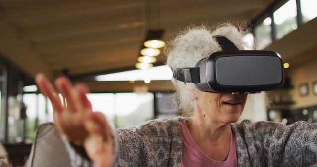 Senior Woman Immersed in Virtual Reality Experience at Home - Download Free Stock Images Pikwizard.com
