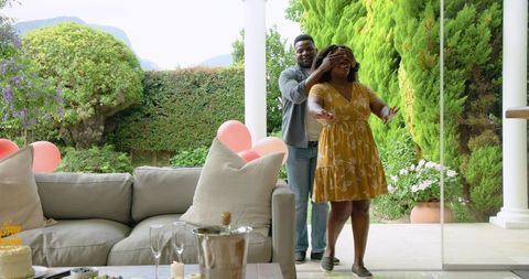 African American Couple Engaging Leisurely on Garden Patio