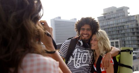 Couple Smiling in Urban City Enjoying Adventures and Capturing Memories
