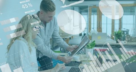 Analyzing financial data on digital display in modern office