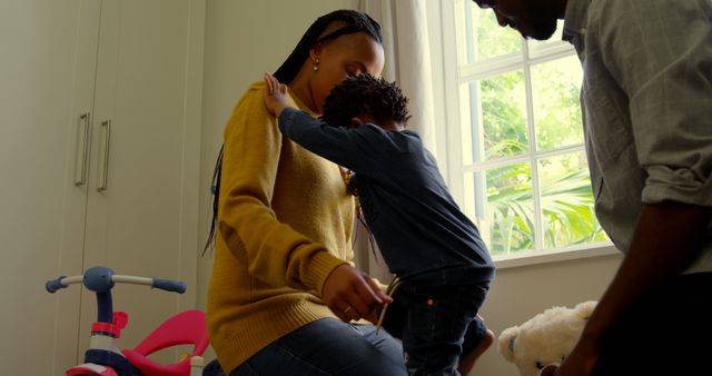 Young family interacting at home, nurturing childhood bonds - Download Free Stock Images Pikwizard.com