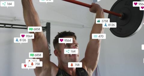 Muscular man lifting barbell overhead in minimalist gym with social media notifications