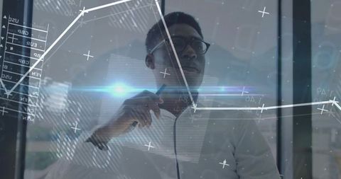 Businessman Analyzing Digital Charts on Glass Board in Modern Office