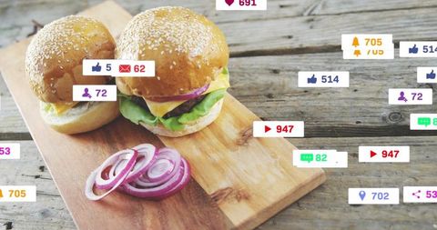 Rustic sesame cheeseburgers on wood board with red onion and social media overlay