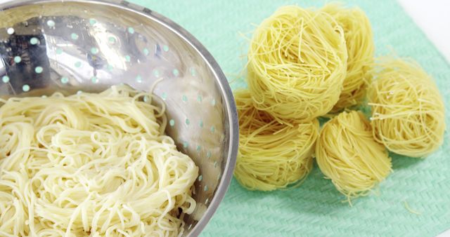 Freshly Boiled and Dry Egg Noodles in Colander and on Countertop - Download Free Stock Images Pikwizard.com