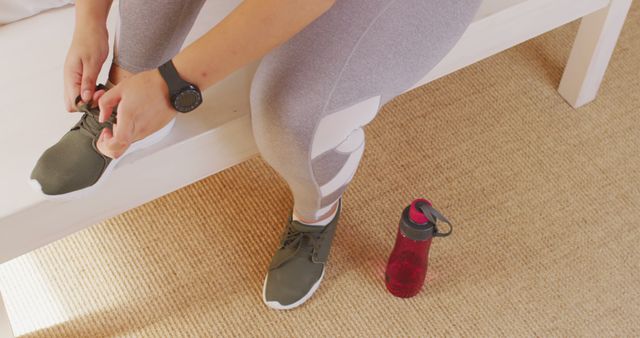 Fitness Enthusiast Tying Shoes After Workout At Home - Download Free Stock Images Pikwizard.com