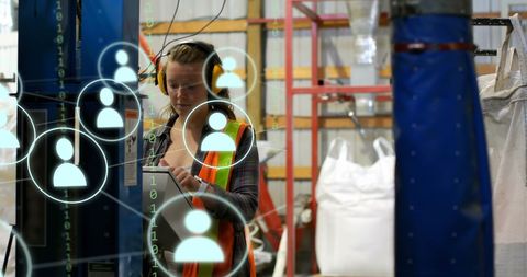 Caucasian female worker engaged in data processing within an industrial warehouse environment. Digital icons and cloud computing elements indicate modern technological integration in logistics and global shipping. Useful for illustrating concepts of digital transformation, industry 4.0, technology in logistics, and the intersection of industrial work with advanced computing solutions.