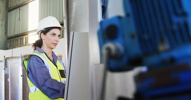 Female Engineer Operating Machinery in Industrial Factory - Download Free Stock Images Pikwizard.com