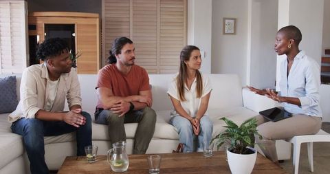 Informal group discussion led by enthusiastic woman