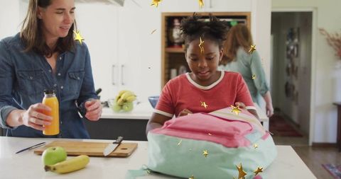 Mother and Daughter Preparing for School in Cozy Kitchen