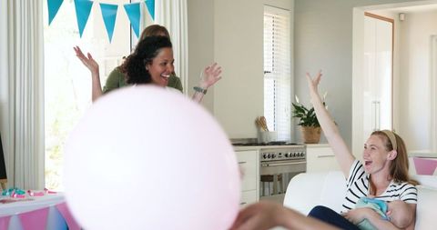 Joyful Baby Shower Celebration with Friends and Family in Bright Living Room