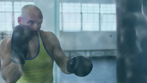 Boxer Training with Punching Bag in Modern Gym