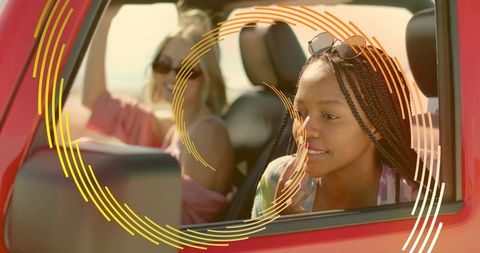Joyful Road Trip with Friends in Red Convertible on Sunny Day