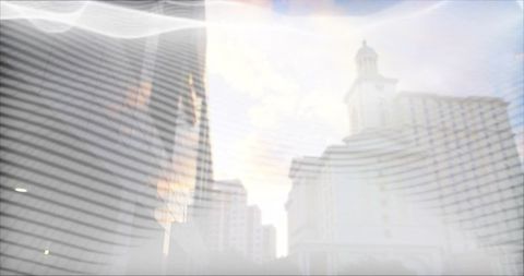 Translucent female profile blending with curved skyscraper skyline and sun flare