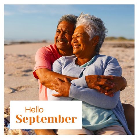 Joyful senior couple embracing on beach welcomes september