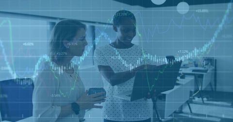 Businesswomen Collaborating in Modern Tech-Savvy Office Environment