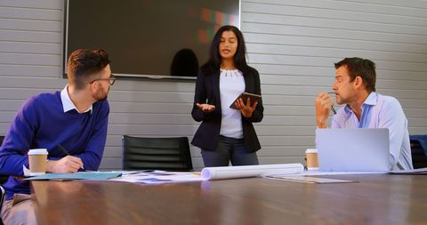 Multi-ethnic business meeting in modern office