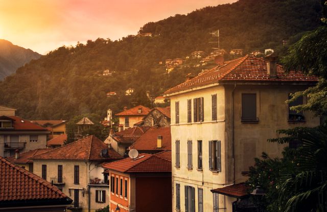 Sunset Over Italian Village with Mountain Background - Download Free Stock Photos Pikwizard.com
