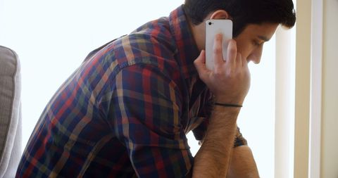 Young Man Having Important Phone Conversation Indoors - Download Free Stock Images Pikwizard.com