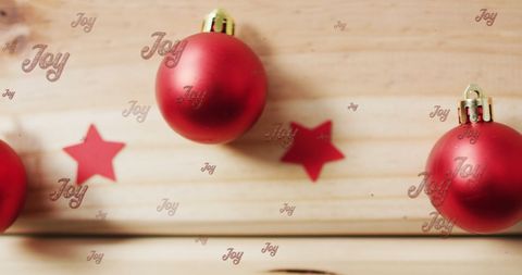 Festive Red Christmas Baubles on Wooden Background