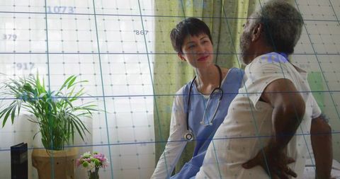 Home nurse listening to senior patient during in-home care visit with stethoscope