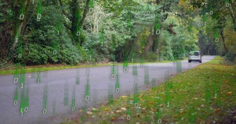 Minivan moving on forest road, binary code rising to show connected vehicle data flow