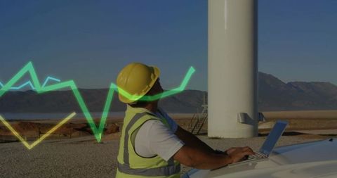 Engineer Working Remotely at Wind Turbine with Data Overlay